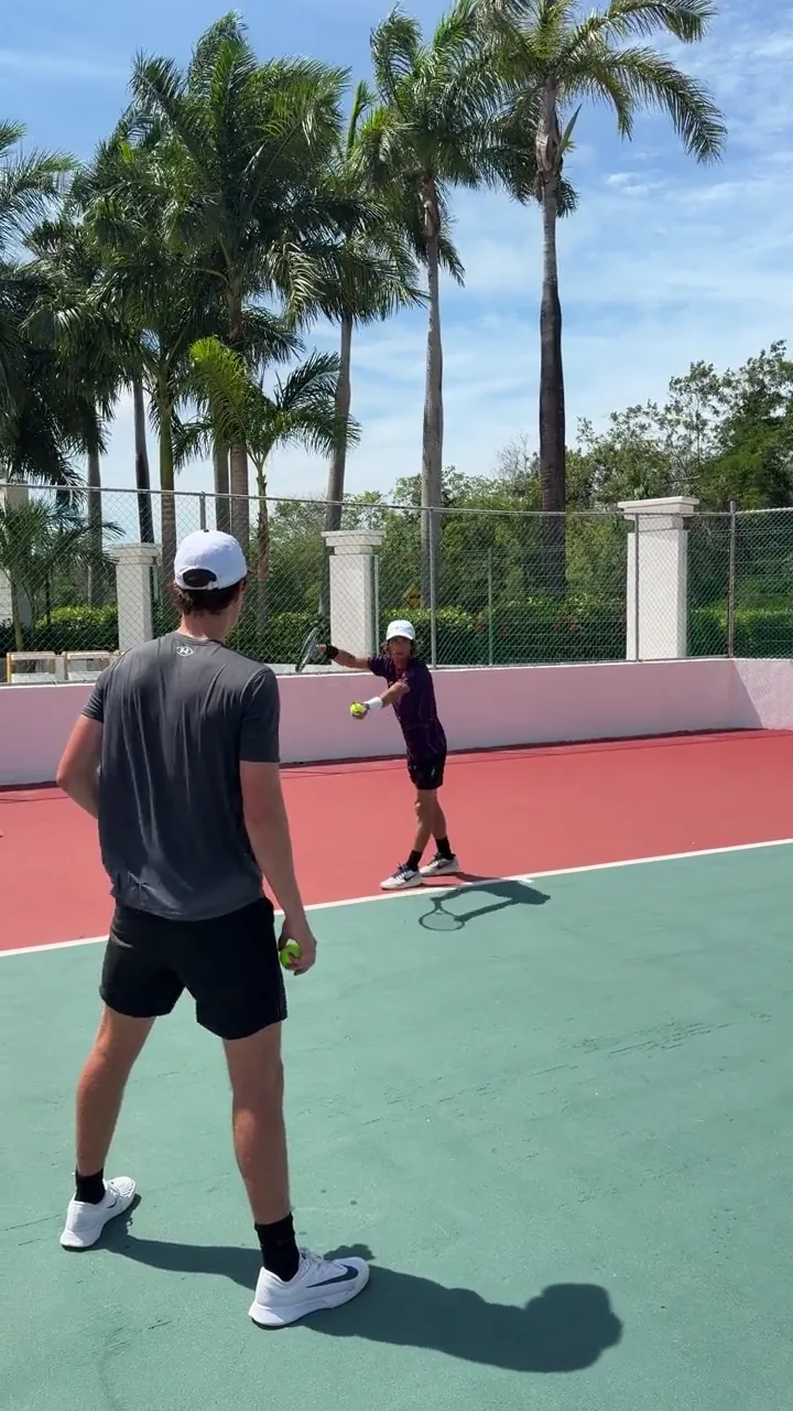 Patrick coaching on a private tennis court
